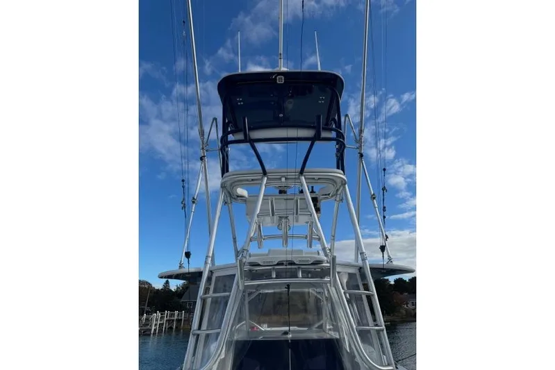  Yacht Photos Pics 2015 SeaHunter Center Console boat with tall tower against blue sky.