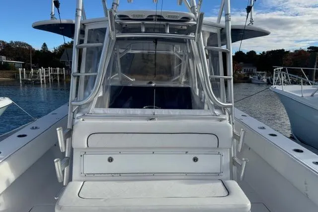  Yacht Photos Pics 2015 SeaHunter Center Console boat docked, featuring spacious seating and sturdy framework.