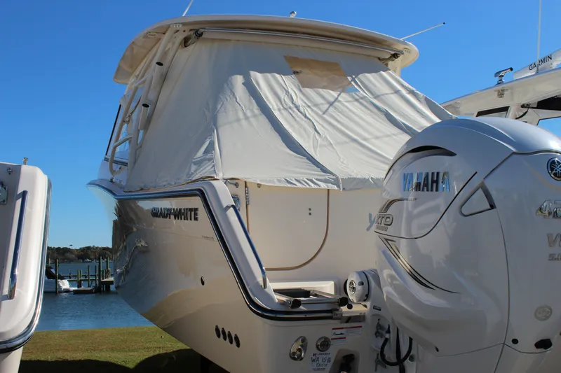 Worry Knot Yacht Photos Pics 2023 Grady-White Freedom 335 boat with Yamaha outboard motor, docked by the water.