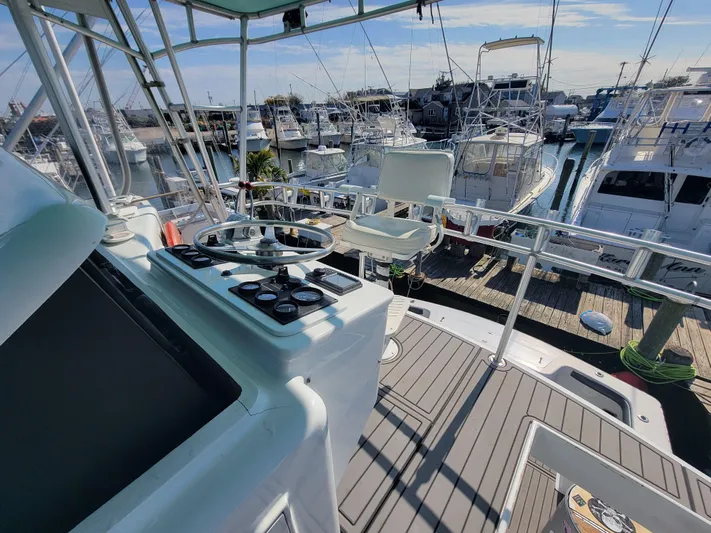  Yacht Photos Pics Helm of 1998 Custom Carolina 45 Willis Boatworks, docked with other boats in marina.