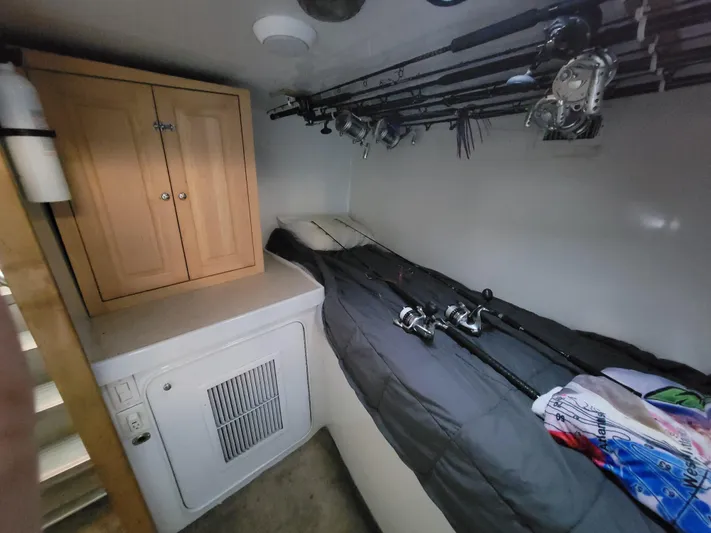  Yacht Photos Pics 1998 Custom Carolina 45 Willis Boatworks cabin with fishing rods and storage.