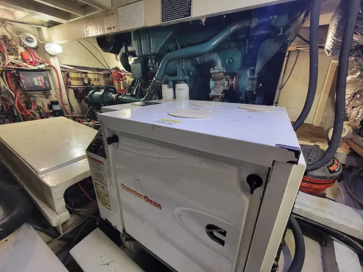  Yacht Photos Pics Engine room of 1998 Custom Carolina 45 Willis Boatworks, featuring Cummins Onan generator.