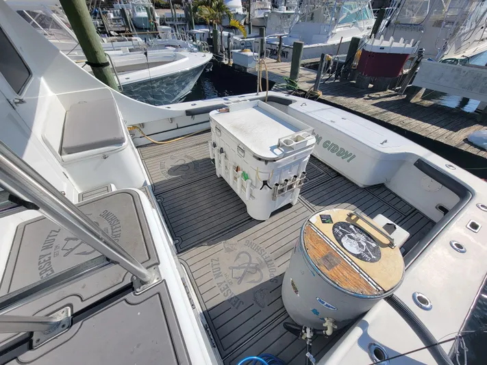  Yacht Photos Pics 1998 Custom Carolina 45 Willis Boatworks deck with fishing gear and cooler.