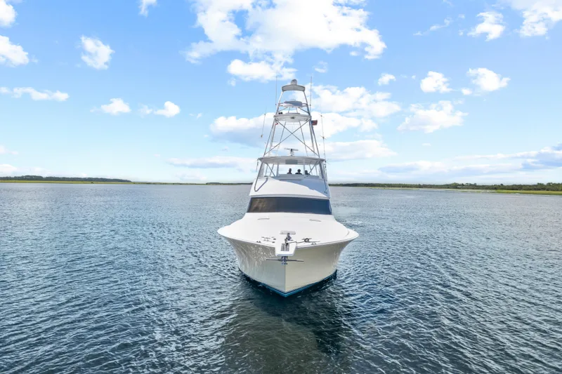 Sea Meant Yacht Photos Pics 2005 Viking 61 Convertible yacht on open water under blue sky.