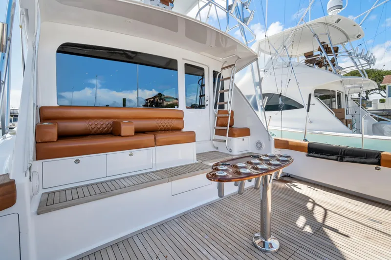 Sea Meant Yacht Photos Pics Luxurious 2005 Viking 61 Convertible yacht with elegant seating and fishing rod holders.