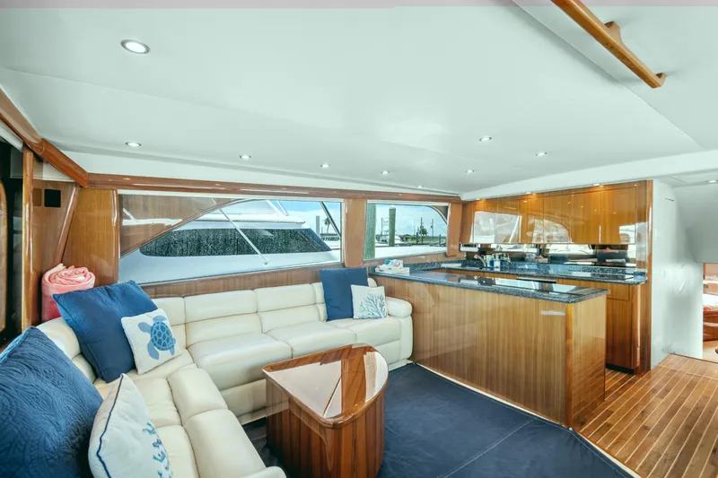 Sea Meant Yacht Photos Pics Luxurious interior of a 2005 Viking 61 Convertible yacht with elegant wood finishes.