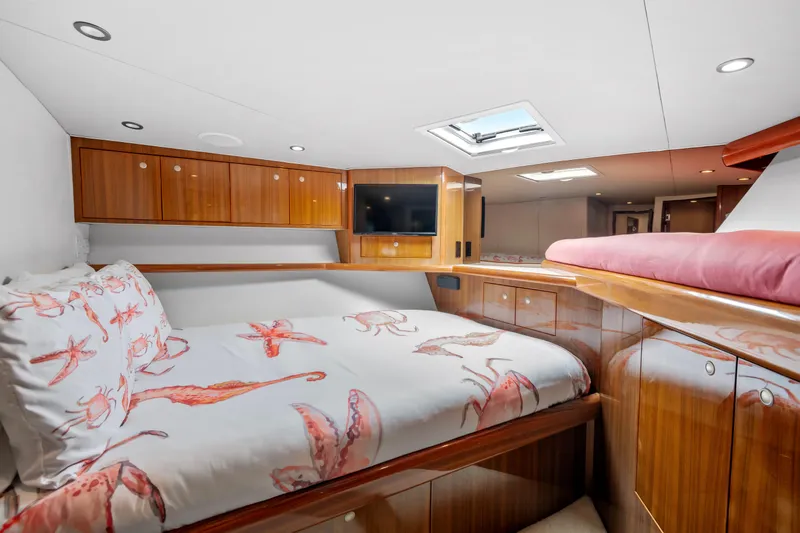 Sea Meant Yacht Photos Pics Luxurious cabin interior of 2005 Viking 61 Convertible yacht with elegant wood finish.