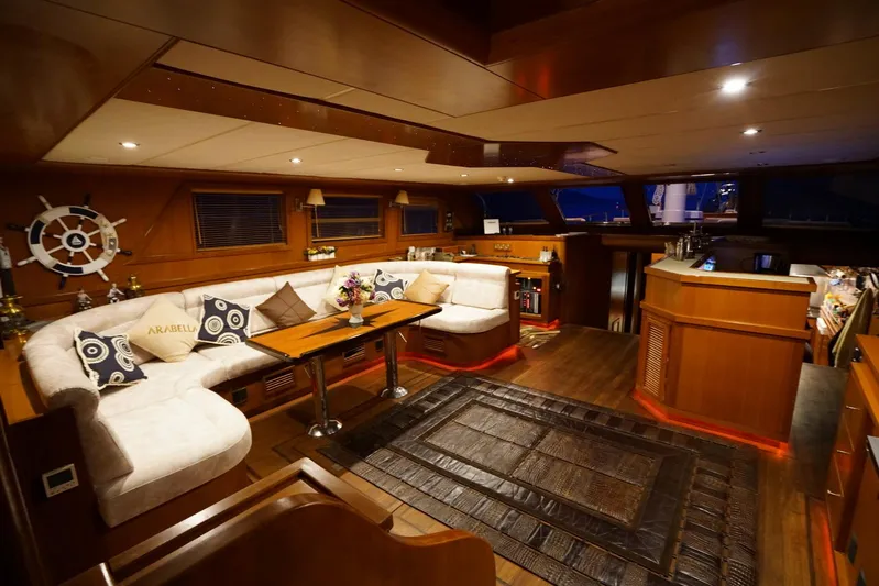  Yacht Photos Pics Luxurious interior of a 2007 custom 32-metre gulet with elegant wood finishes and plush seating.