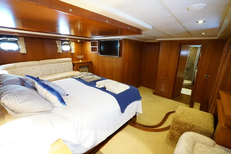  Yacht Photos Pics Luxurious cabin interior of a 2007 Custom 32 metre Gulet with cozy bed and modern amenities.