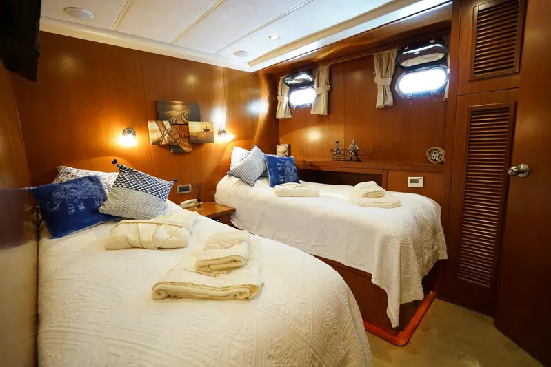  Yacht Photos Pics Luxurious twin cabin on a 2007 Custom 32 metre Gulet yacht, featuring elegant wood paneling.