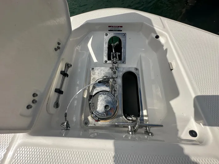  Yacht Photos Pics Anchor compartment of 2022 Robalo R272 boat with chain and winch.