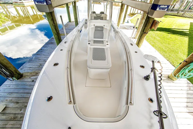  Yacht Photos Pics 2023 Front Runner 33 Center Console boat docked, showcasing sleek design and spacious deck.