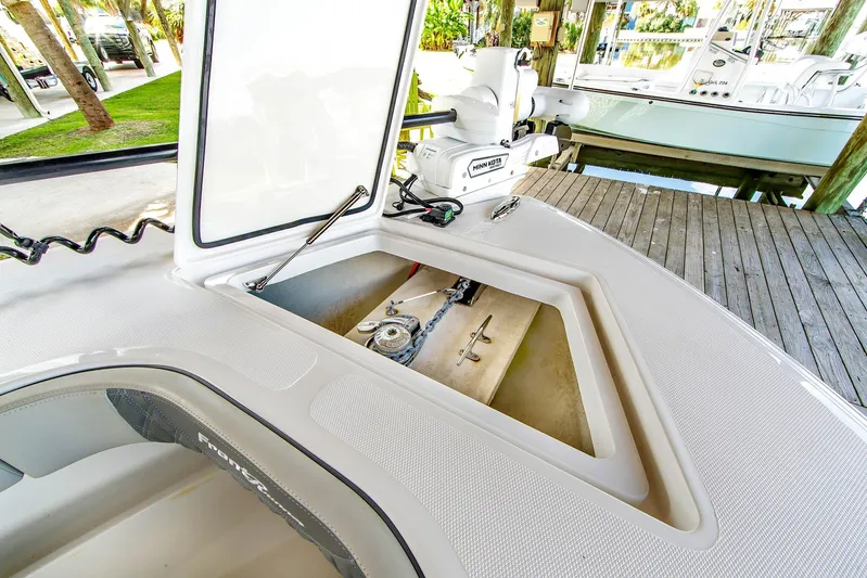  Yacht Photos Pics 2023 Front Runner 33 Center Console boat with open storage compartment and Minn Kota motor.