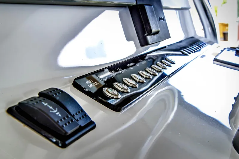  Yacht Photos Pics Control panel of 2023 Front Runner 33 Center Console boat, featuring switches and levers.