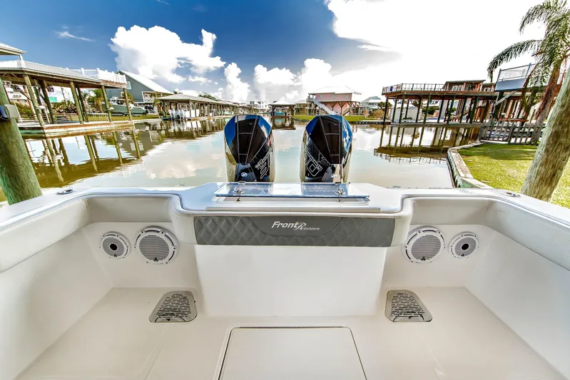  Yacht Photos Pics 2023 Front Runner 33 Center Console boat docked in a scenic marina setting.