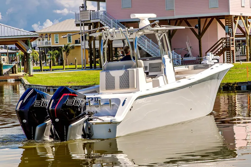  Yacht Photos Pics 2023 Front Runner 33 Center Console boat with dual engines on a calm waterway.