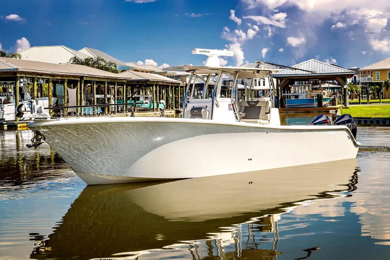  Yacht Photos Pics 2023 Front Runner 33 Center Console boat docked in a marina under a clear sky.