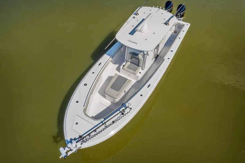  Yacht Photos Pics 2023 Front Runner 33 Center Console boat on calm water, aerial view.