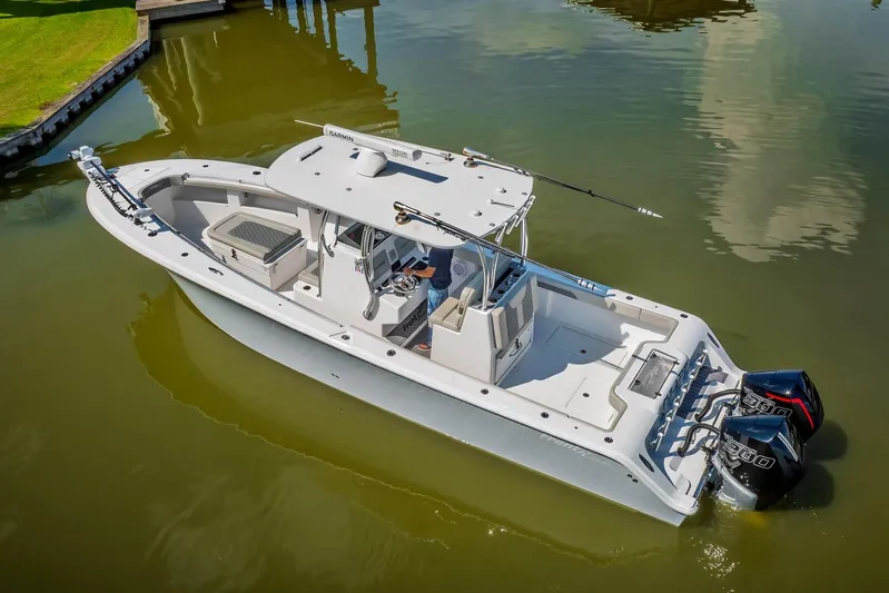  Yacht Photos Pics 2023 Front Runner 33 Center Console boat on calm water, featuring dual engines.