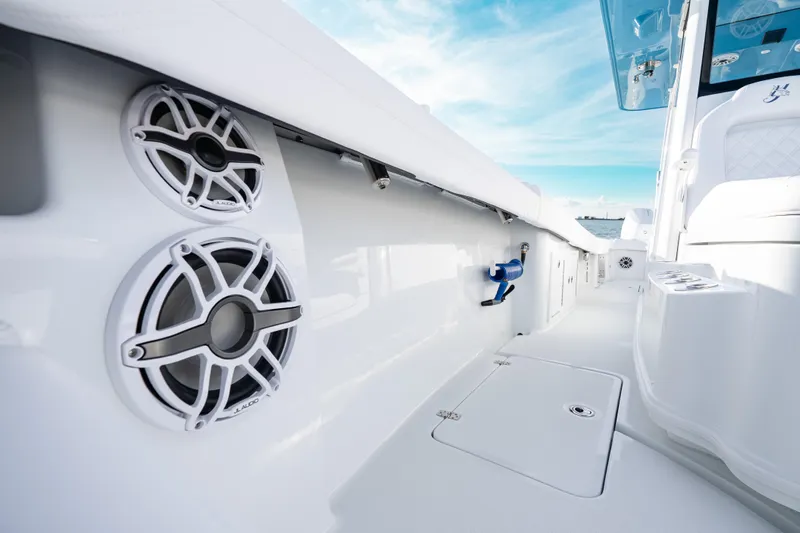  Yacht Photos Pics 2026 Yellowfin 36 Offshore boat interior with speakers and storage compartments.