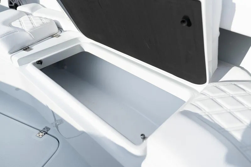  Yacht Photos Pics 2026 Yellowfin 36 Offshore boat storage compartment with cushioned seating.