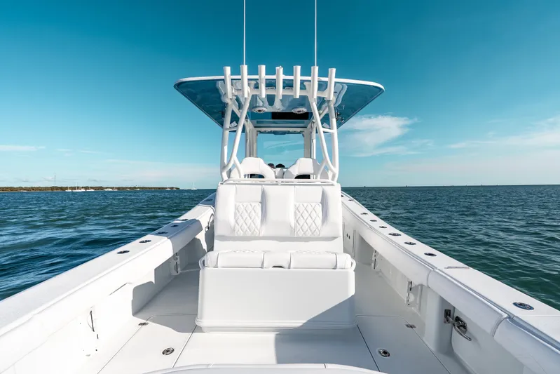  Yacht Photos Pics 2026 Yellowfin 36 Offshore boat on open water under clear blue sky.