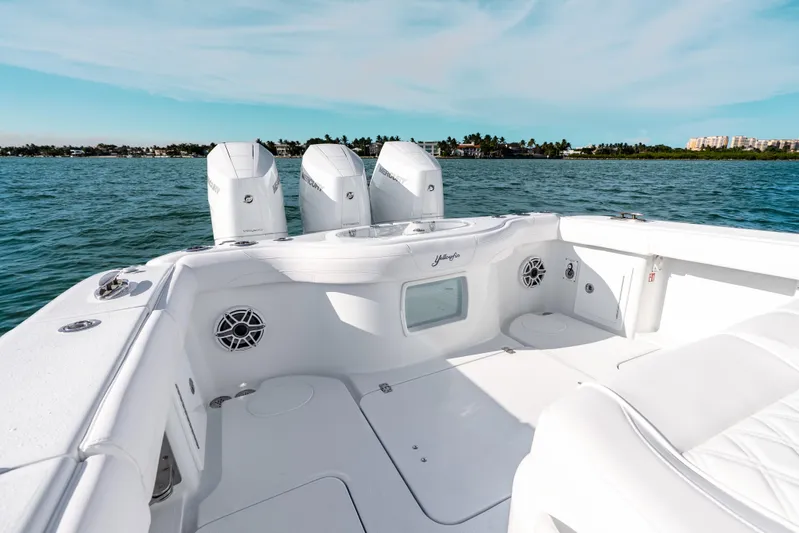 Yacht Photos Pics 2026 Yellowfin 36 Offshore boat with triple engines on open water.