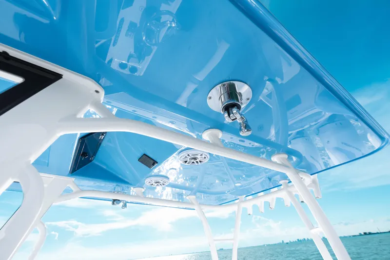  Yacht Photos Pics 2026 Yellowfin 36 Offshore boat, blue canopy, ocean view, modern design features.