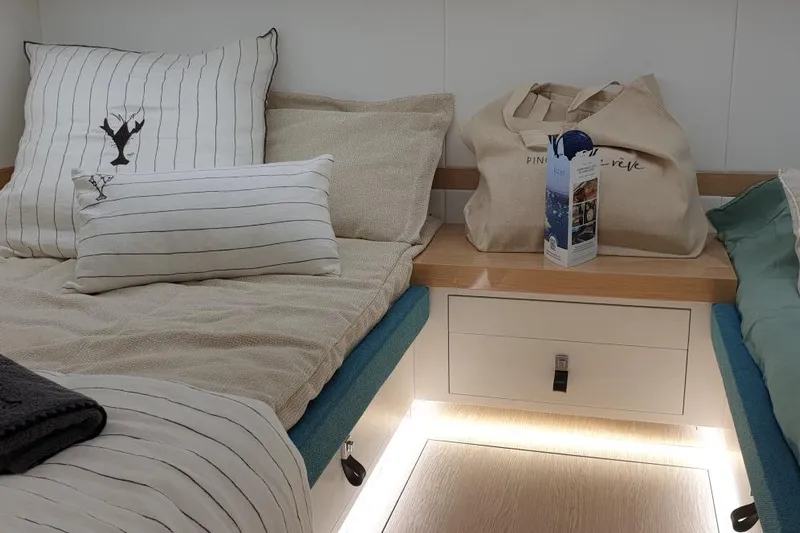 Cigale 8 Yacht Photos Pics Cozy cabin interior of 2023 Rio Yachts Daytona 50 with stylish bedding and ambient lighting.