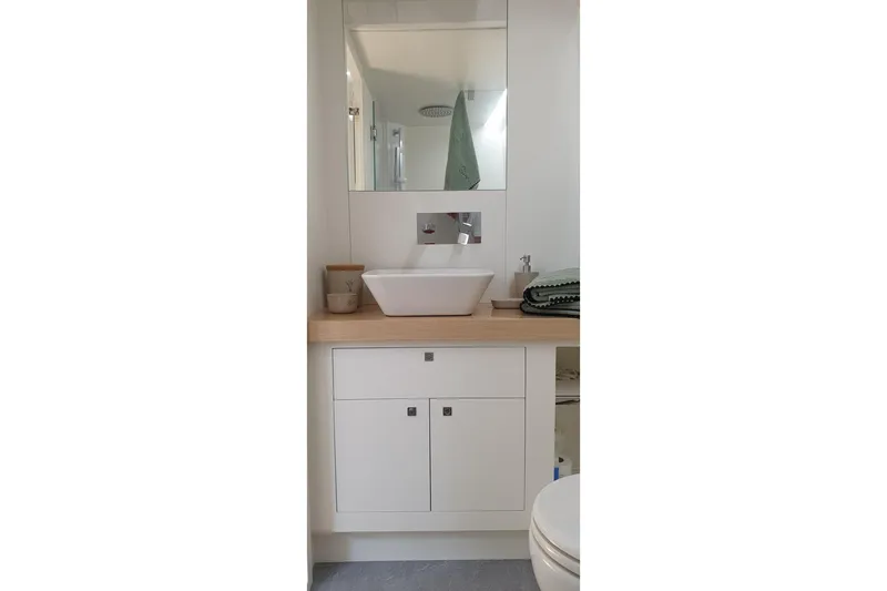 Cigale 8 Yacht Photos Pics Modern bathroom vanity on Rio Yachts Daytona 50, 2023 model, with vessel sink and mirror.