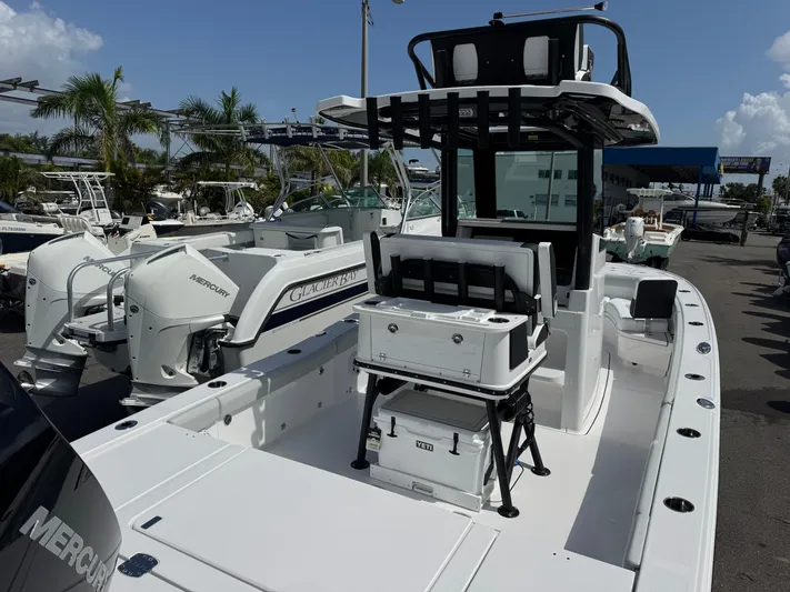  Yacht Photos Pics 2026 Blackfin 262 HB boat with dual Mercury engines, docked under a clear blue sky.