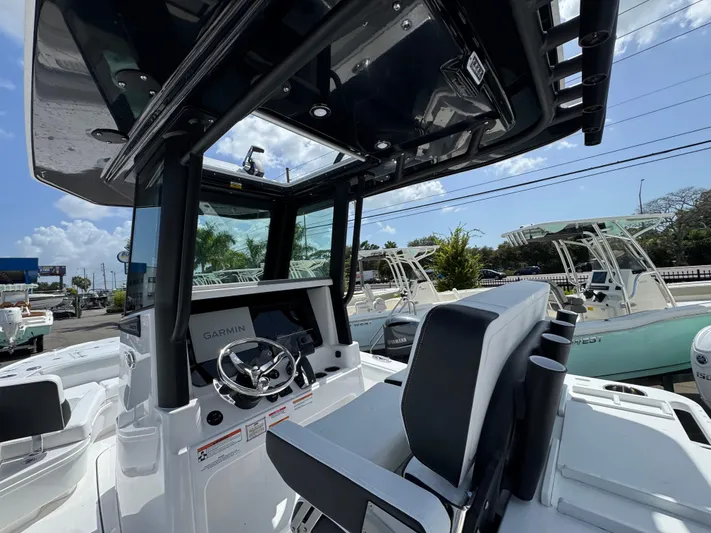  Yacht Photos Pics 2026 Blackfin 262 HB boat interior with Garmin navigation system and sleek design.