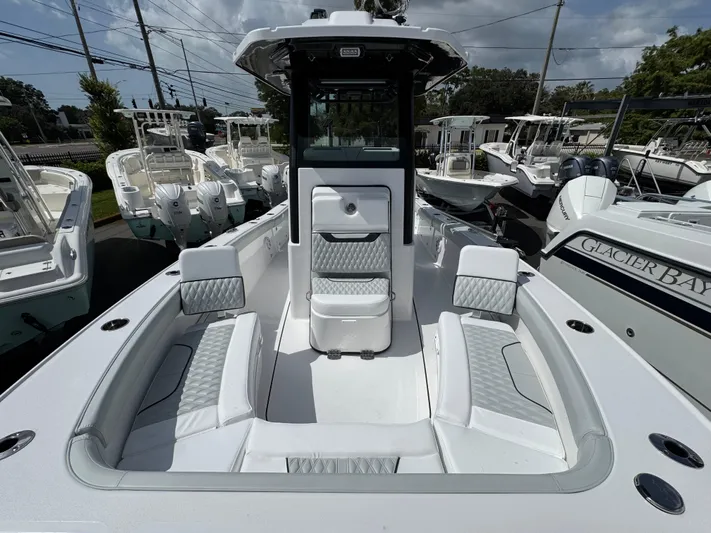  Yacht Photos Pics 2026 Blackfin 262 HB boat with spacious seating and modern design in a marina setting.