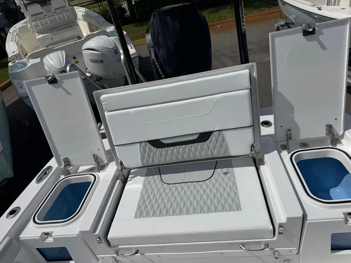  Yacht Photos Pics 2026 Blackfin 262 HB boat with open storage compartments and seating area.