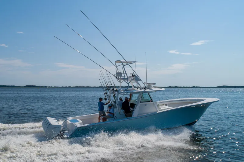 Reel Development Yacht Photos Pics 2022 Onslow Bay 41 TE boat cruising on open water, clear sky.
