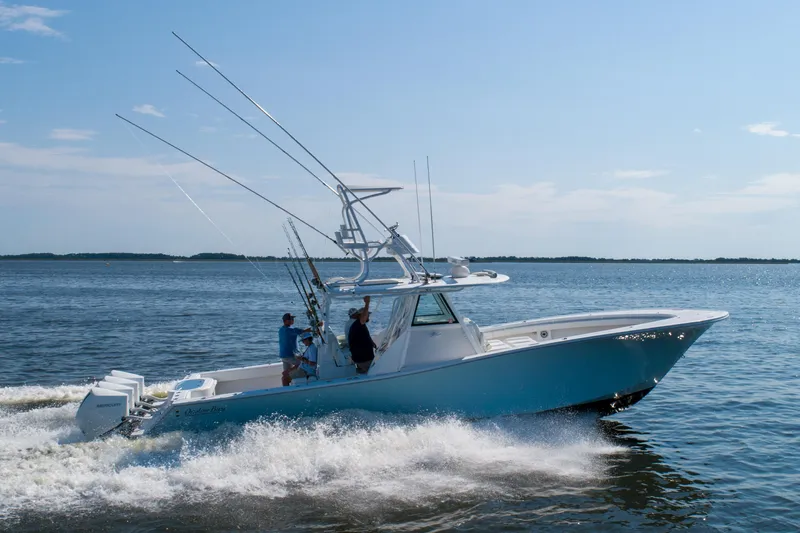 Reel Development Yacht Photos Pics 2022 Onslow Bay 41 TE boat cruising on open water, clear sky background.