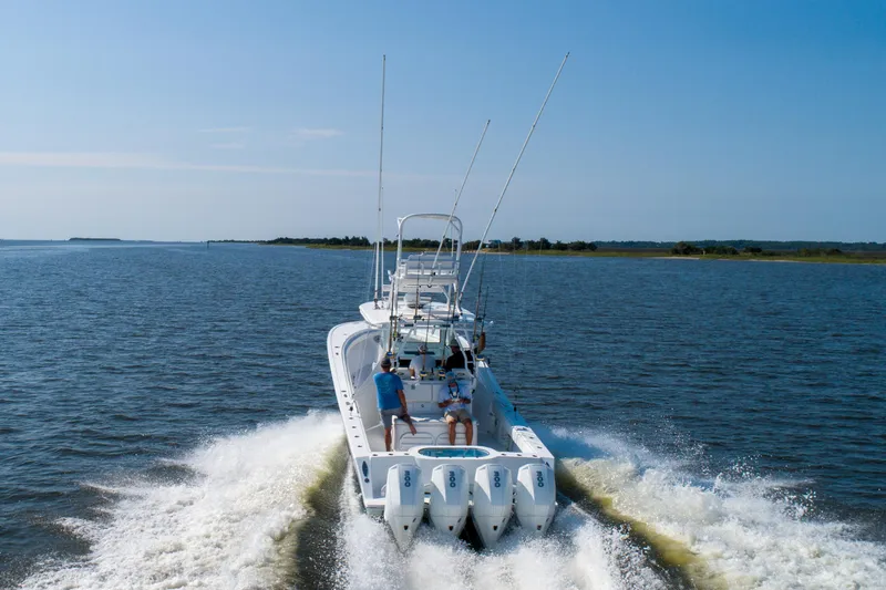 Reel Development Yacht Photos Pics 2022 Onslow Bay 41 TE boat cruising on open water with four engines.