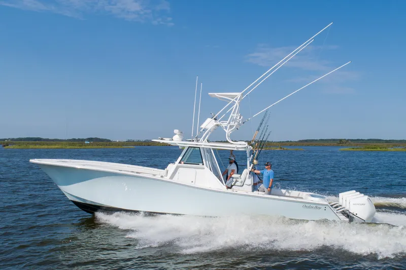 Reel Development Yacht Photos Pics 2022 Onslow Bay 41 TE boat cruising on open water under clear blue sky.