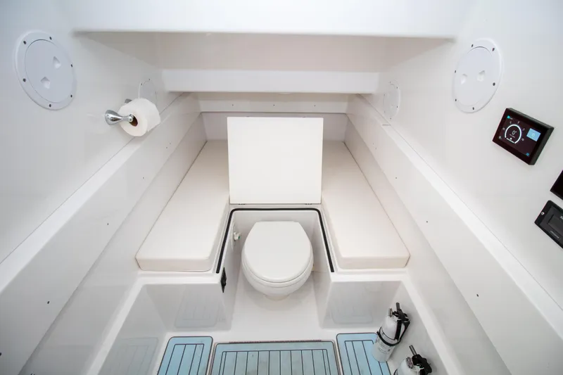 Reel Development Yacht Photos Pics 2022 Onslow Bay 41 TE boat interior with toilet and seating area.