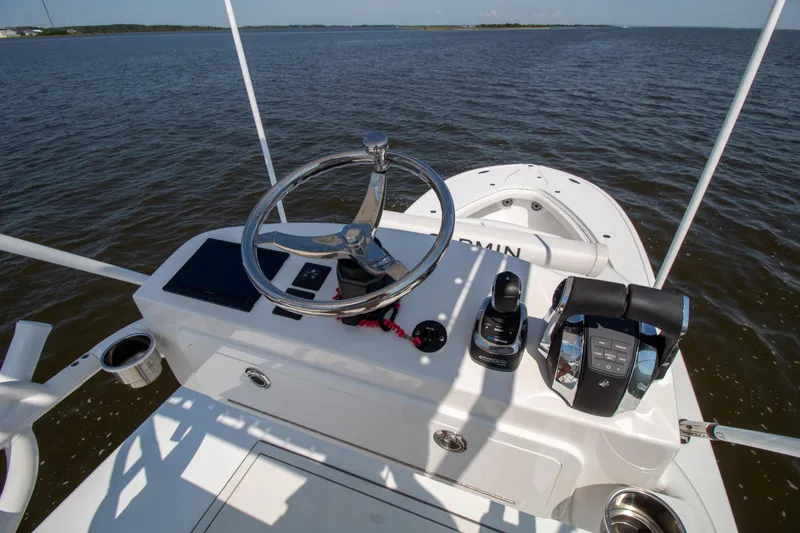 Reel Development Yacht Photos Pics 2022 Onslow Bay 41 TE boat helm with steering wheel and controls on open water.
