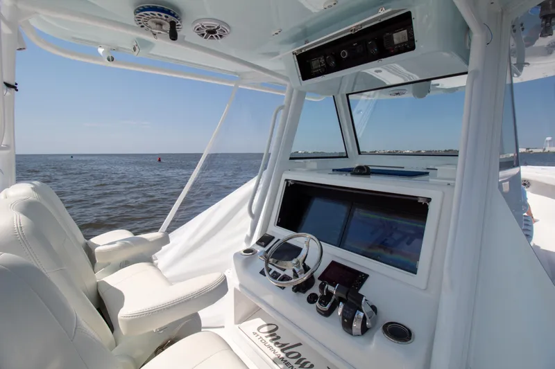 Reel Development Yacht Photos Pics 2022 Onslow Bay 41 TE boat interior with advanced navigation system and ocean view.