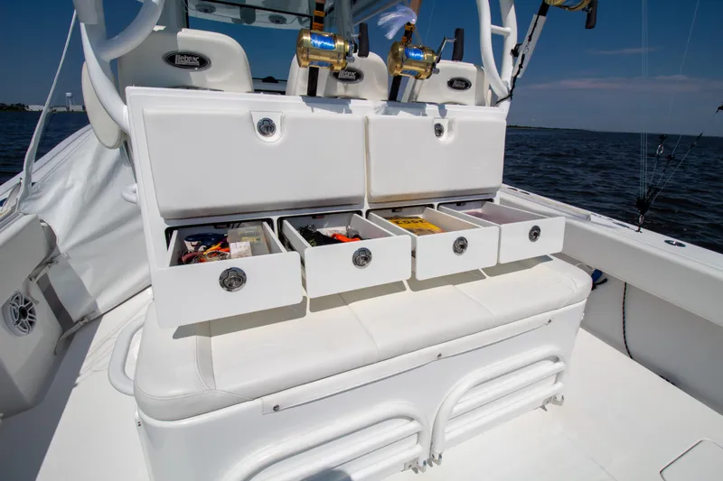 Reel Development Yacht Photos Pics Onslow Bay 41 TE 2022 boat with open storage drawers and fishing gear.