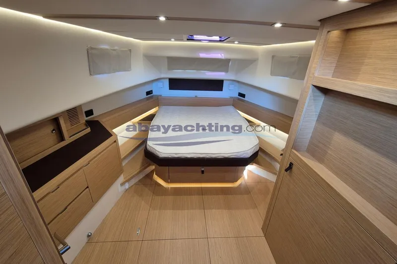  Yacht Photos Pics Luxurious interior of 2022 Pardo Yachts 50, featuring modern wood finishes and ambient lighting.