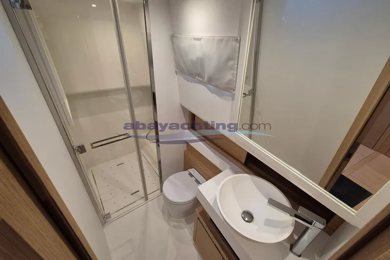  Yacht Photos Pics Modern bathroom in 2022 Pardo Yachts 50, featuring sleek shower and basin design.