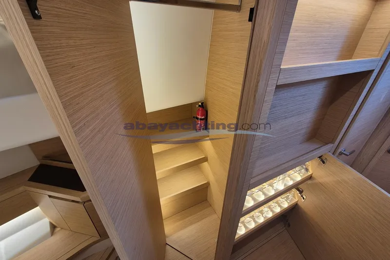  Yacht Photos Pics Interior of 2022 Pardo Yachts 50, featuring wooden cabinetry and stairs.
