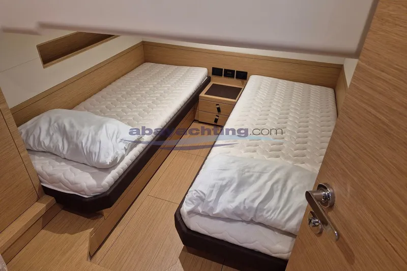  Yacht Photos Pics Interior cabin of 2022 Pardo Yachts 50 with twin beds and wooden finish.