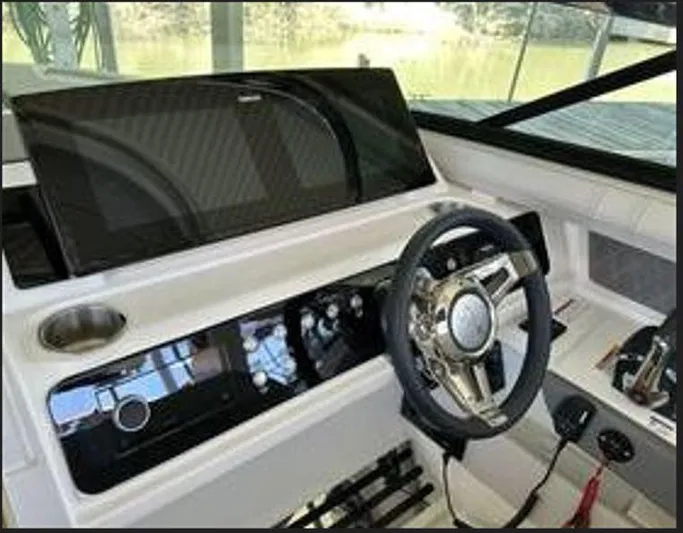  Yacht Photos Pics 2024 Sea Ray SLX 310 OB helm with modern steering and control panel.