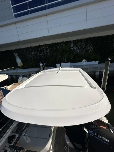  Yacht Photos Pics 2024 Sea Ray SLX 310 OB boat with sleek white deck design.