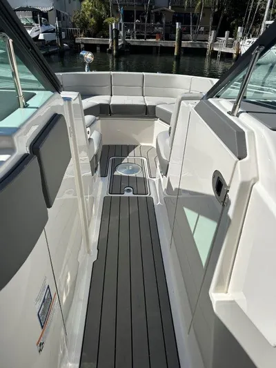  Yacht Photos Pics 2024 Sea Ray SLX 310 OB boat interior with sleek seating and modern design.