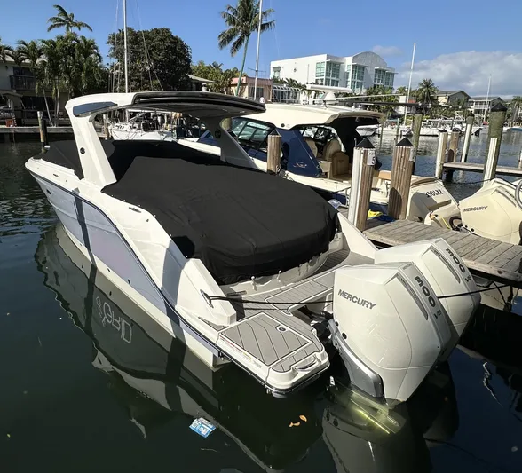 Yacht Photos Pics 2024 Sea Ray SLX 310 OB boat docked with twin Mercury outboard engines.